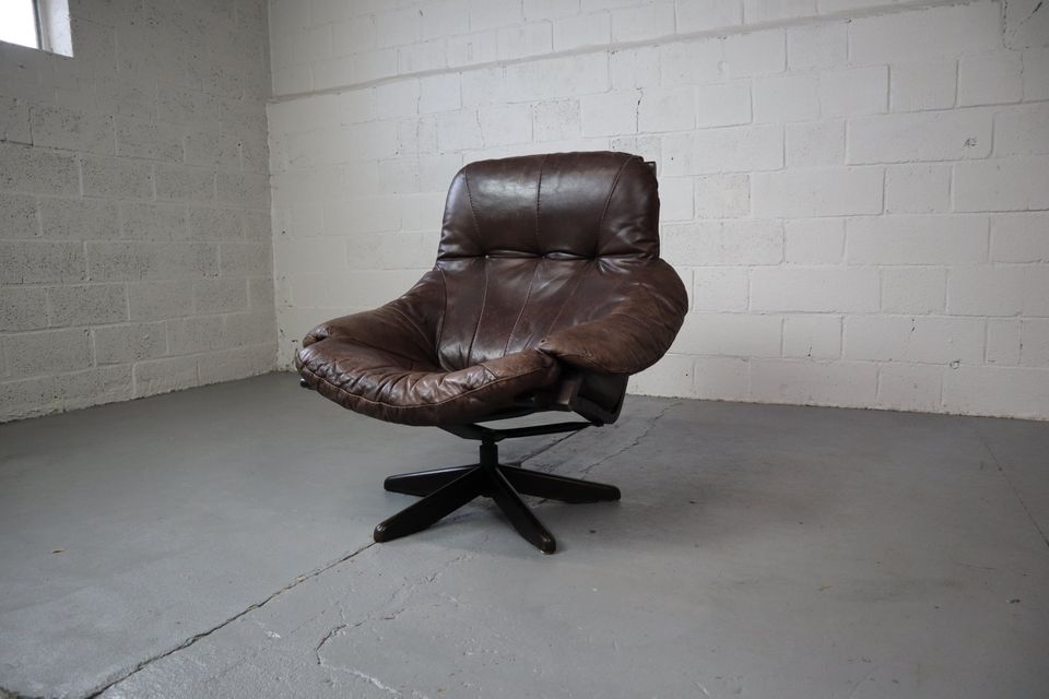 Leather swivel chair by Gerald Easden